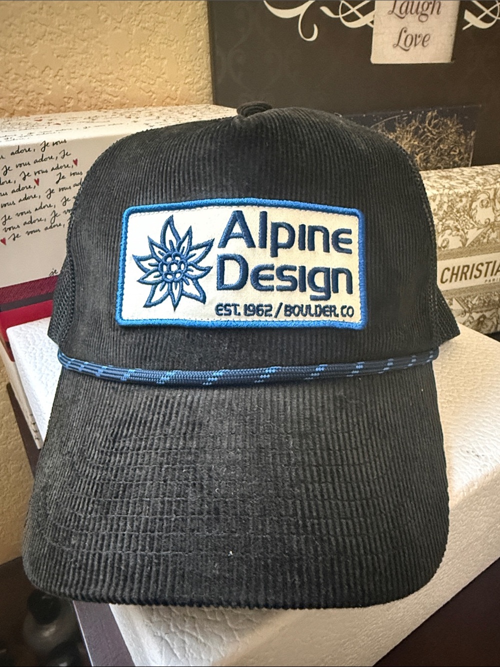 Alpine Design Black Corduroy Patch Trucker Hat with Blue Trim